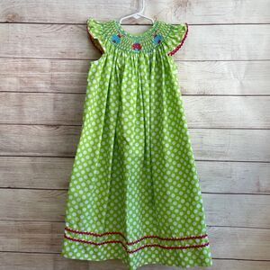 STITCHED AND‎ SMOCKED GREEN AND WHITE POLKA DOT DRESS WITH EMBROIDERED LADYBUGS